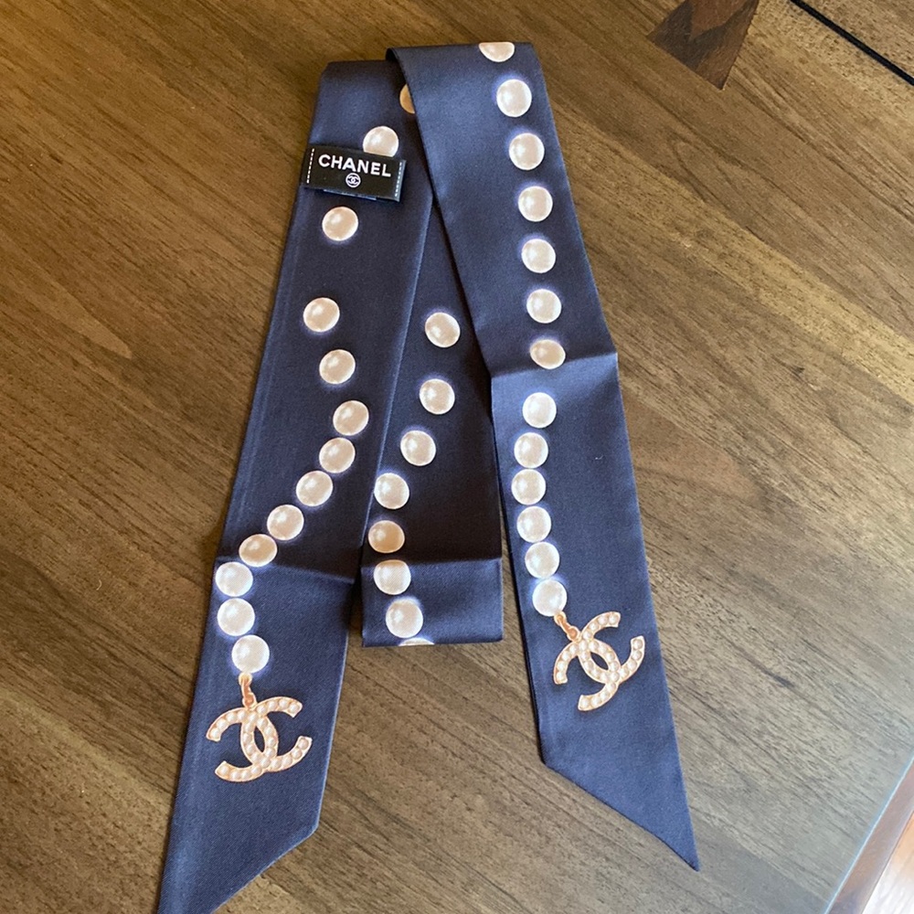 Chanel Twilly in navy blue color with pearls in the design
